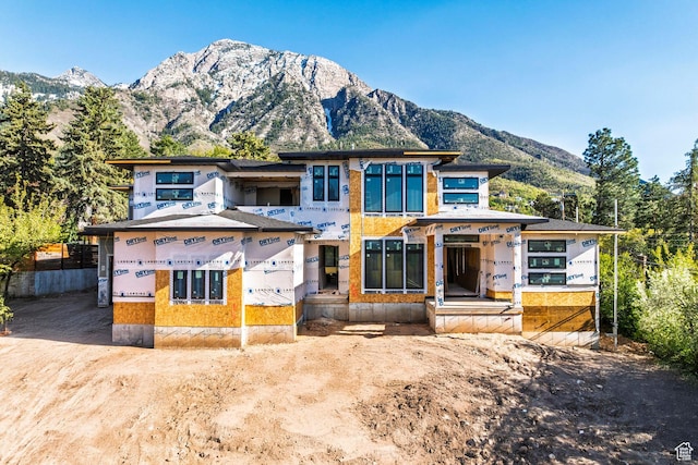 unfinished property featuring a mountain view