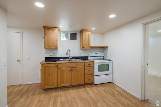 142 Hillside Dr, Moab, UT 84532 - kitchen with white electric range oven, a sink, light wood-style floors, baseboards, and recessed lighting