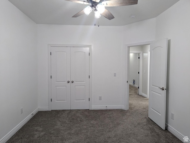 unfurnished bedroom featuring carpet floors and baseboards