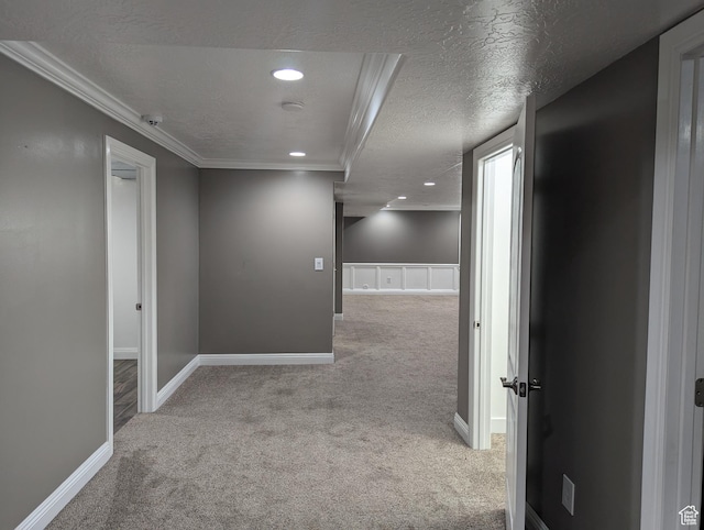hall with carpet, crown molding, recessed lighting, baseboards, and a textured ceiling