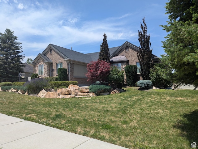 3312 W Country Bluff Rd Unit 5, South Jordan, UT 84095 - view of front of house with brick siding and a front yard