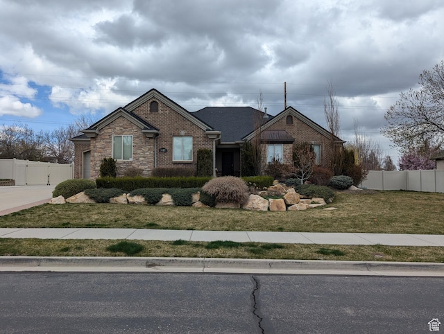 ranch-style house featuring brick siding, driveway, and a garage