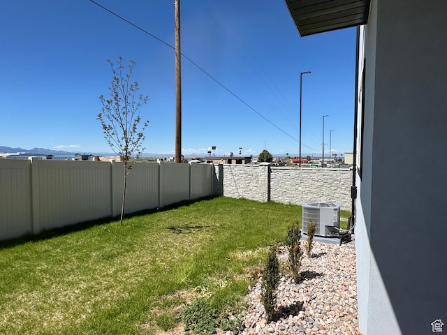 view of yard with central AC