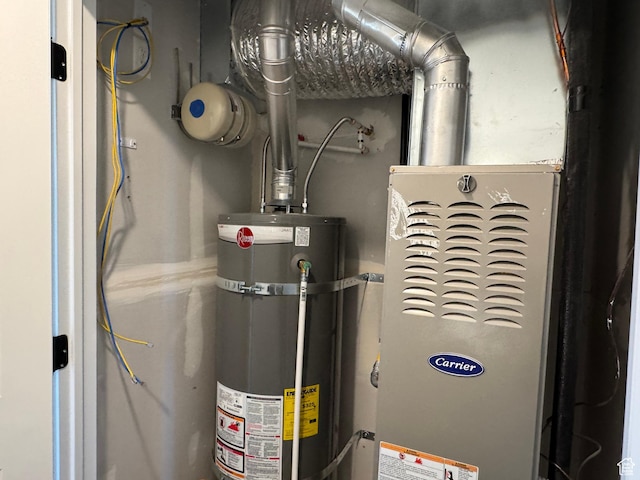 utility room with strapped water heater
