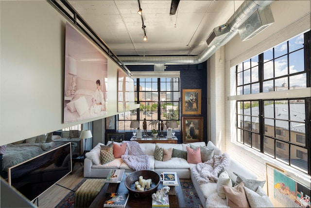 159 W Broadway Unit 411, Salt Lake City, UT 84101 - living area featuring wood finished floors and rail lighting