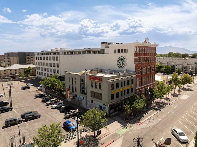 159 W Broadway Unit 411, Salt Lake City, UT 84101 - view of building exterior with uncovered parking and a mountain view