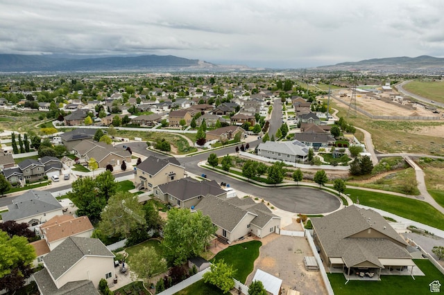 aerial view of property's location featuring nearby suburban area and mountains