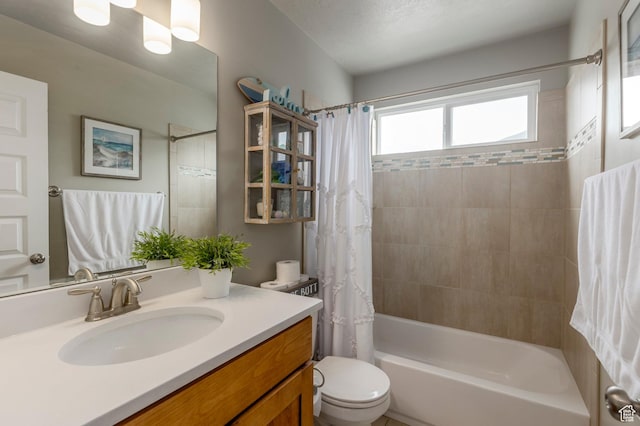 full bath featuring shower / bath combo, toilet, and vanity