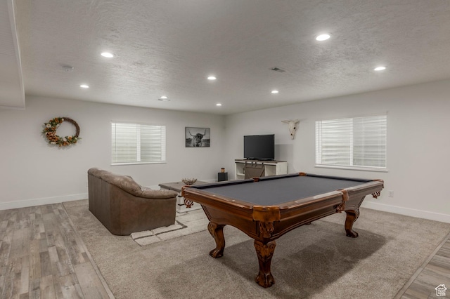 rec room with recessed lighting, billiards table, a textured ceiling, light wood finished floors, and baseboards