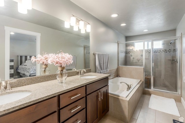 bathroom featuring a shower stall, a garden tub, tile patterned flooring, double vanity, and connected bathroom