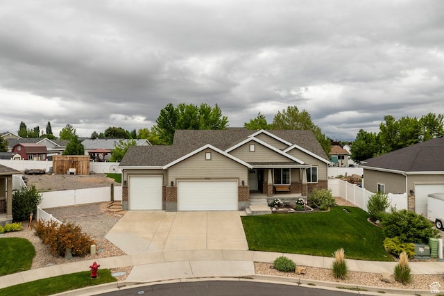 view of front of property featuring a garage, brick siding, driveway, and a porch