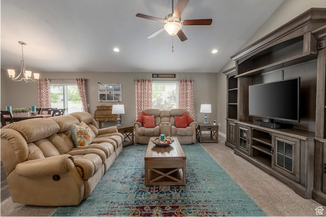 living area with a chandelier, ceiling fan, recessed lighting, light colored carpet, and vaulted ceiling