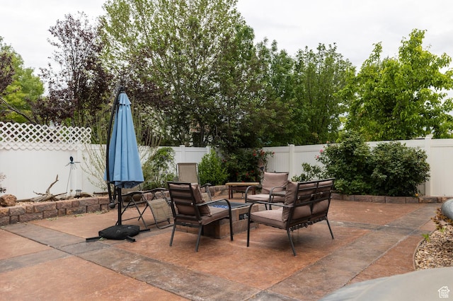 view of patio / terrace with a fenced backyard and an outdoor living space