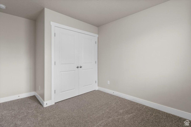 930 N 90 W, Santaquin, UT 84655 - unfurnished bedroom featuring carpet floors, baseboards, and a closet