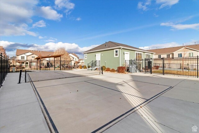 930 N 90 W, Santaquin, UT 84655 - rear view of house featuring a residential view, fence, a tennis court, and stucco siding