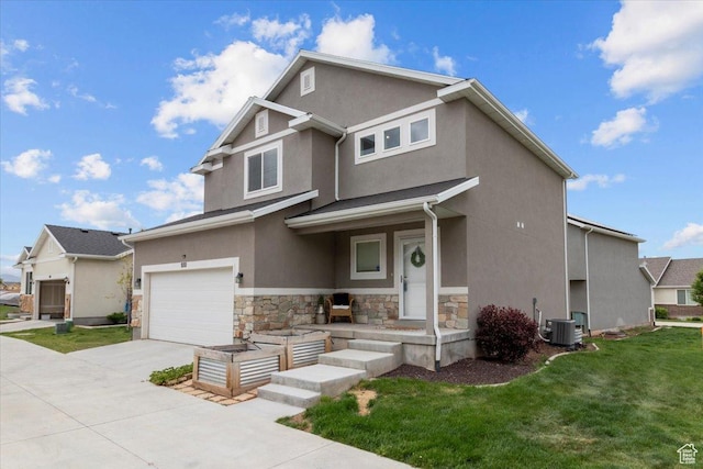 930 N 90 W, Santaquin, UT 84655 - view of front facade featuring stone siding, concrete driveway, an attached garage, stucco siding, and central AC