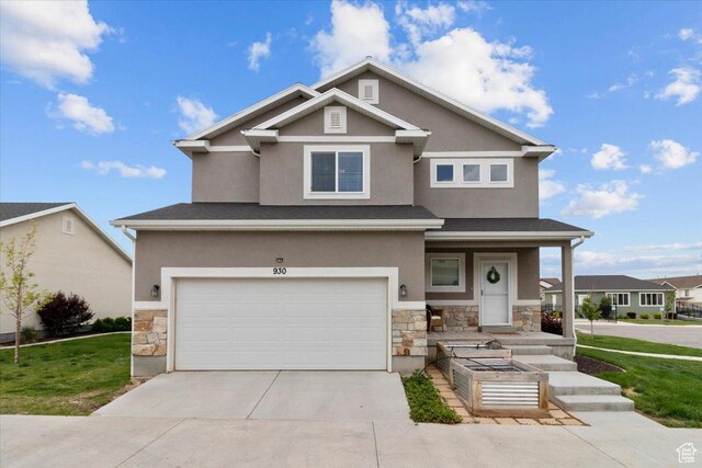 930 N 90 W, Santaquin, UT 84655 - view of front facade with stone siding, stucco siding, concrete driveway, and an attached garage