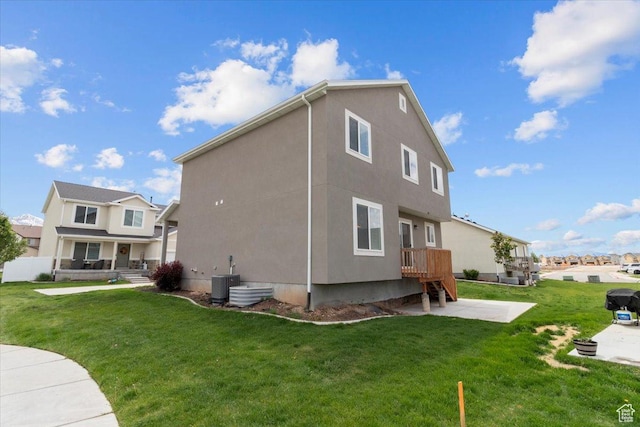 930 N 90 W, Santaquin, UT 84655 - rear view of house with stucco siding, cooling unit, a yard, a patio area, and a residential view