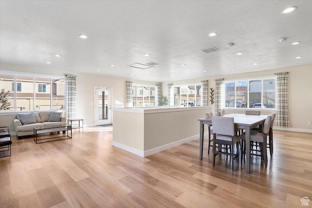 930 N 90 W, Santaquin, UT 84655 - dining area featuring recessed lighting, light wood finished floors, healthy amount of natural light, baseboards, and a textured ceiling