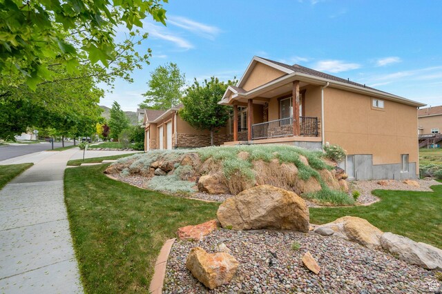 14046 S Emmeline Dr, Herriman, UT 84096 - view of side of property with stucco siding and a garage