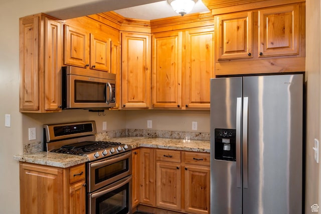 14046 S Emmeline Dr, Herriman, UT 84096 - kitchen featuring appliances with stainless steel finishes and light stone countertops