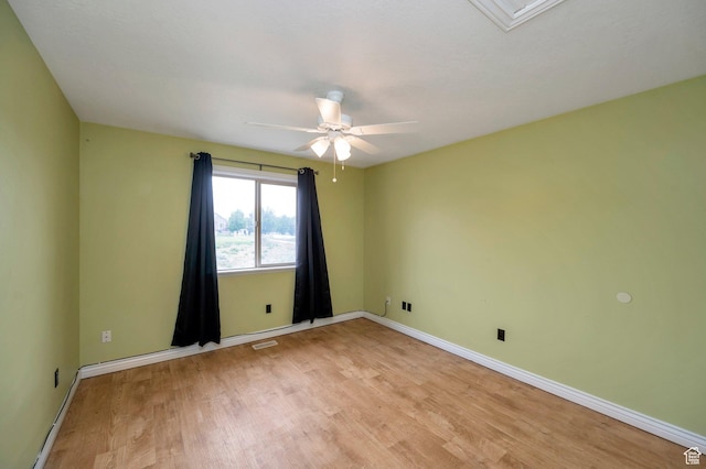 14046 S Emmeline Dr, Herriman, UT 84096 - empty room featuring light wood-style floors, a ceiling fan, and baseboards