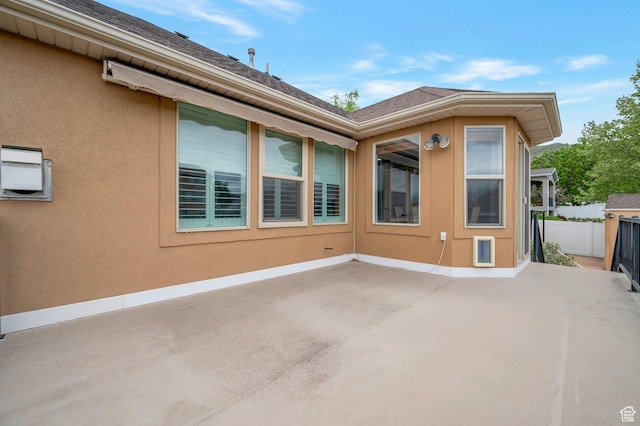 14046 S Emmeline Dr, Herriman, UT 84096 - rear view of property featuring a patio area, fence, and a shingled roof