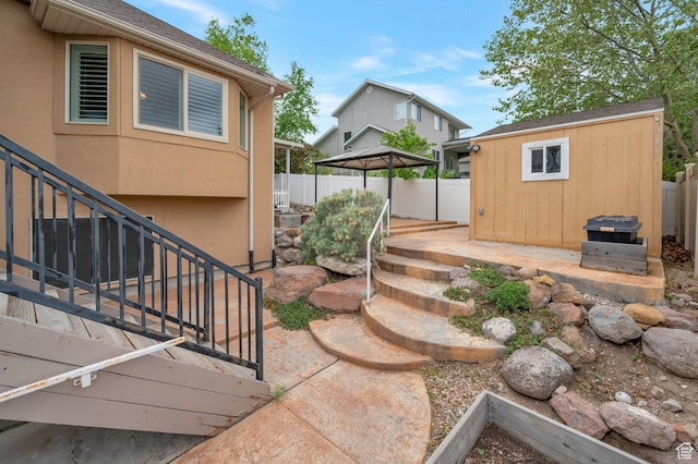 14046 S Emmeline Dr, Herriman, UT 84096 - view of yard featuring a gazebo, an outdoor structure, fence, stairs, and a patio