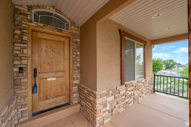 14046 S Emmeline Dr, Herriman, UT 84096 - doorway to property with stone siding and a porch