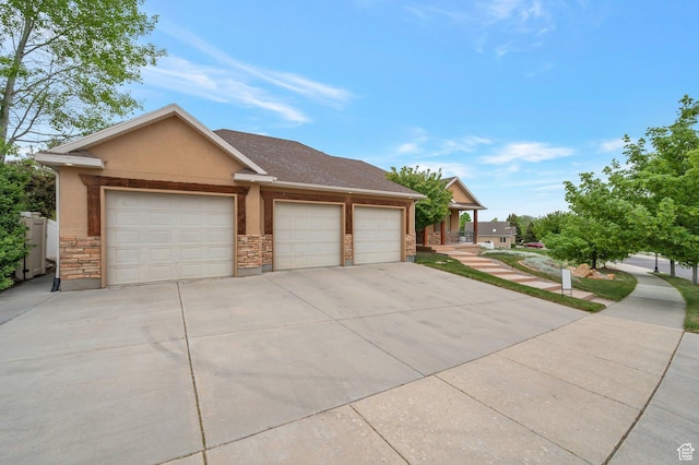 14046 S Emmeline Dr, Herriman, UT 84096 - view of front facade featuring stone siding, stucco siding, and concrete driveway