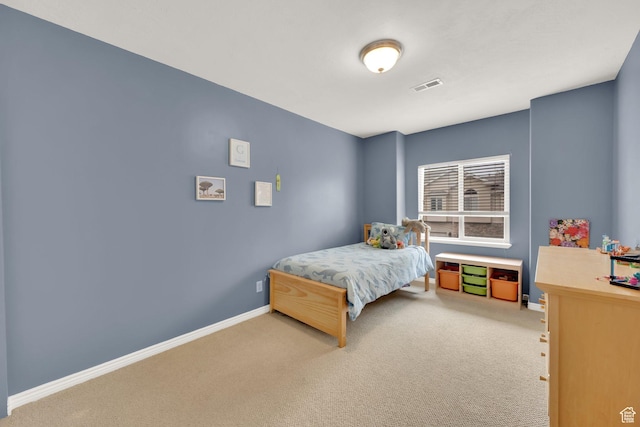 bedroom with carpet and baseboards