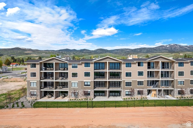 35 E 150th St S Unit D101, Garden City, UT 84028 - view of apartment building / complex featuring a mountain view and fence