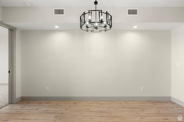 35 E 150th St S Unit D101, Garden City, UT 84028 - unfurnished room with a chandelier, light wood-type flooring, recessed lighting, a smoke detector, and baseboards