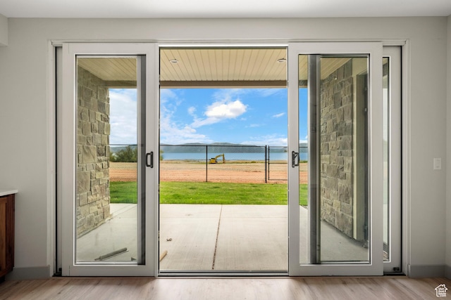 35 E 150th St S Unit D101, Garden City, UT 84028 - doorway with plenty of natural light, a water view, and wood finished floors