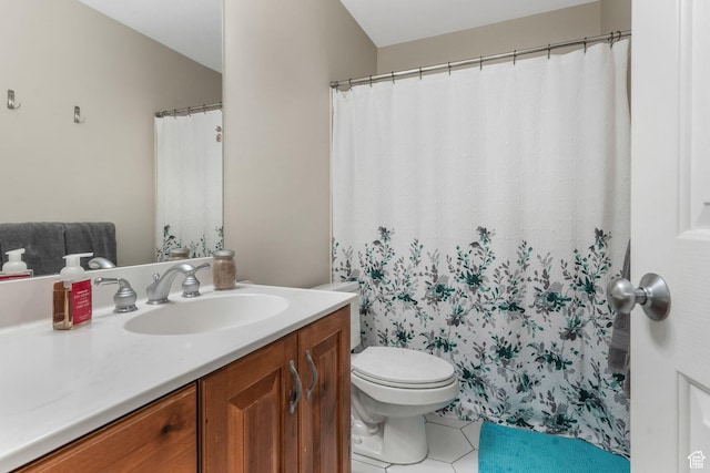 full bathroom with tile patterned flooring, toilet, and vanity