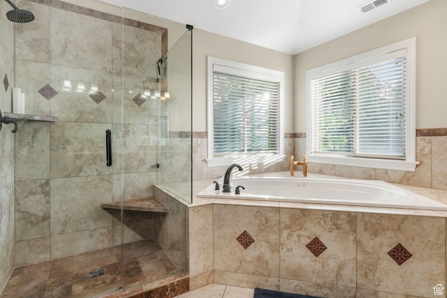 full bathroom with a bath, a stall shower, and a wainscoted wall