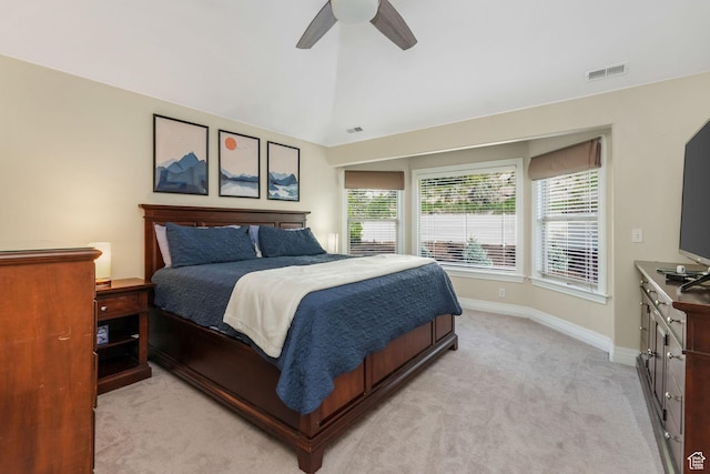 bedroom featuring light colored carpet, baseboards, a ceiling fan, and vaulted ceiling