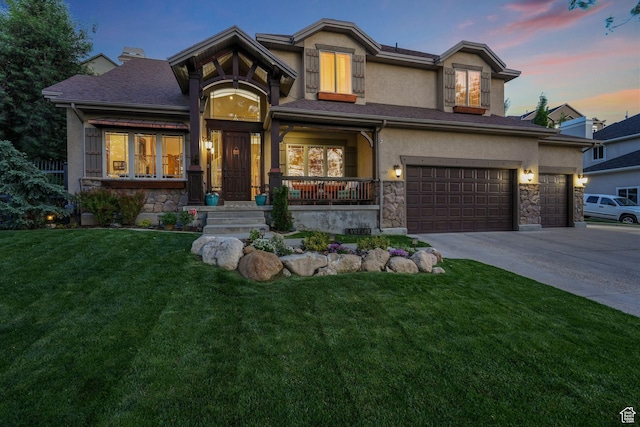 view of front facade featuring stone siding, driveway, and a yard