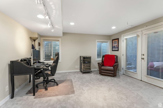 carpeted office space with baseboards, track lighting, beverage cooler, and recessed lighting