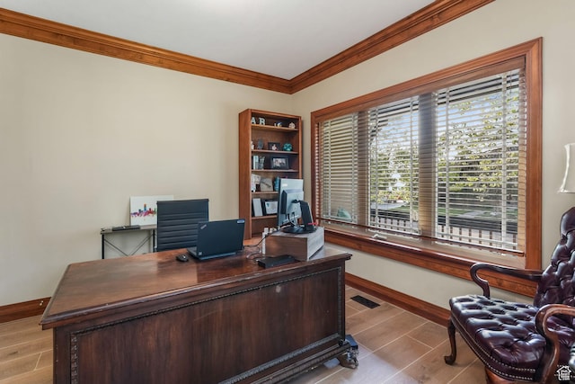 office featuring crown molding, baseboards, and wood finished floors