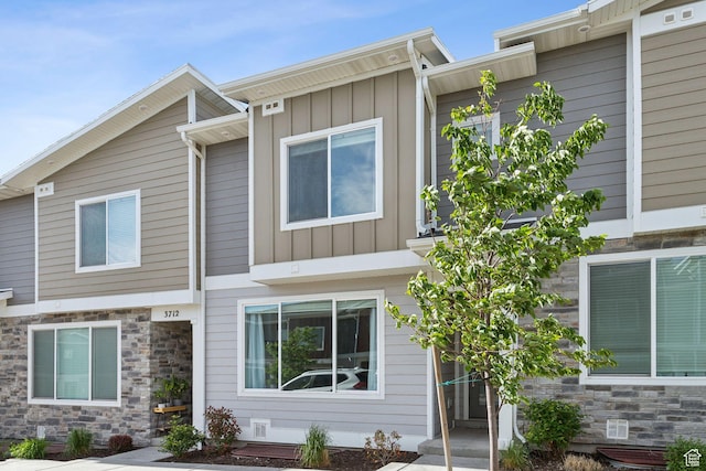 3714 W Soft Whisper Way, Herriman, UT 84096 - back of property featuring board and batten siding and stone siding