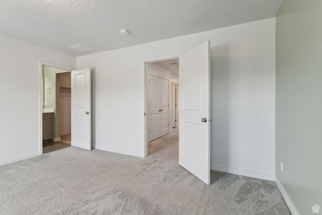3714 W Soft Whisper Way, Herriman, UT 84096 - unfurnished bedroom with light carpet, baseboards, and a textured ceiling