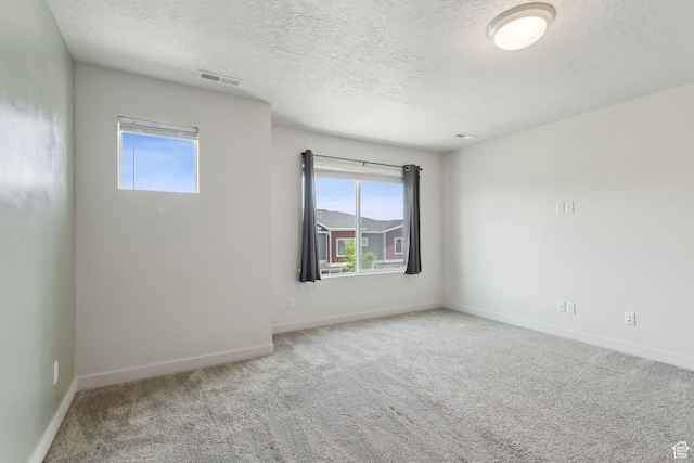 3714 W Soft Whisper Way, Herriman, UT 84096 - carpeted spare room featuring healthy amount of natural light, a textured ceiling, and baseboards