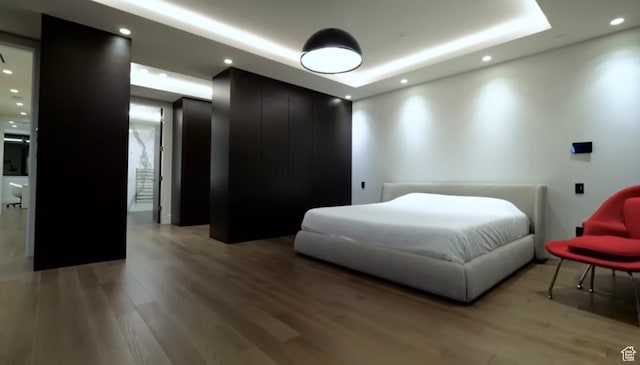 422 N Castor Ln, Salt Lake City, UT 84103 - bedroom with a tray ceiling, light wood finished floors, and recessed lighting