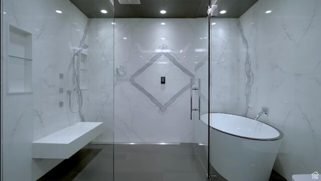 422 N Castor Ln, Salt Lake City, UT 84103 - full bathroom featuring a marble finish shower, tile walls, and a soaking tub