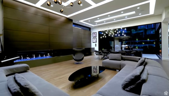 422 N Castor Ln, Salt Lake City, UT 84103 - home theater room featuring a raised ceiling, wood finished floors, and recessed lighting