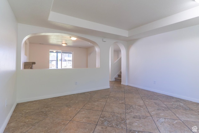 886 Cambridge Dr, North Salt Lake, UT 84054 - unfurnished room featuring a tray ceiling and baseboards