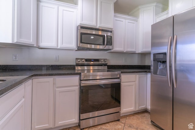 886 Cambridge Dr, North Salt Lake, UT 84054 - kitchen with stainless steel appliances, white cabinetry, and dark stone countertops