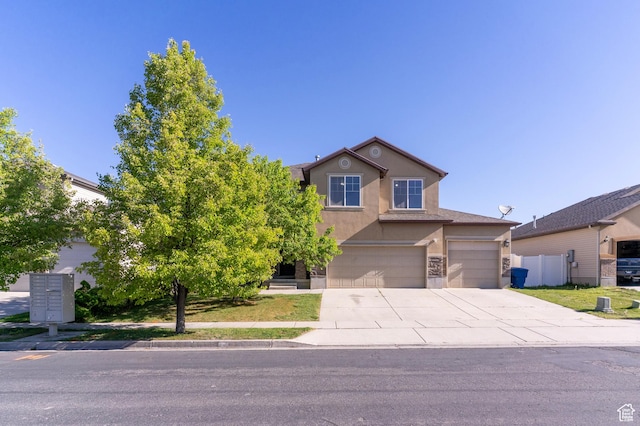 886 Cambridge Dr, North Salt Lake, UT 84054 - traditional home with stucco siding, concrete driveway, a garage, and fence