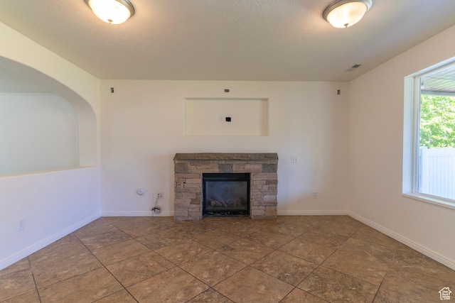 886 Cambridge Dr, North Salt Lake, UT 84054 - unfurnished living room featuring a fireplace and baseboards